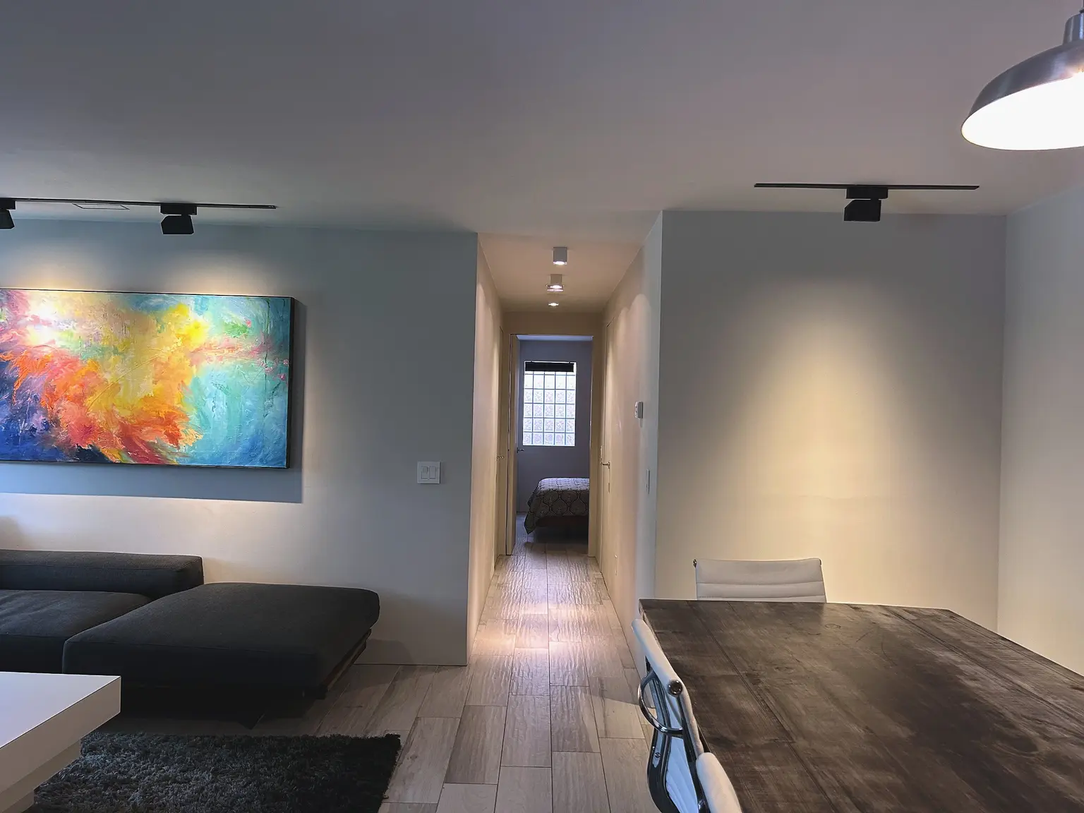 The porcelain-floored hall and living room of apartment 302